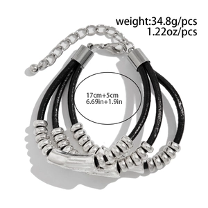 Detail of layered black wax cord bracelet with silver beads and lobster clasp closure