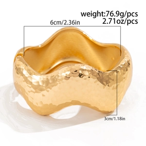 Detail of wide hammered gold cuff bracelet showing 6cm diameter and 3cm width measurements