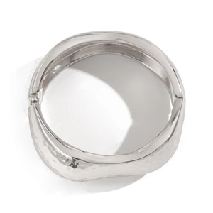 Irregular silver double-layer hammered bangle with a sleek metallic finish and hinge