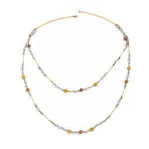 Bohemian layered gold necklace with blue and pink beads and delicate flower pendants