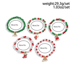 Detailed view of five-piece Christmas beaded bracelet set with Noel and stocking charms