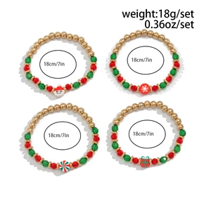 Detailed view of 4-piece Christmas beaded bracelet set with clay Santa and candy charms