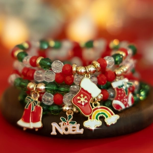 Detail of Christmas beaded bracelet set with Noel pendant and festive holiday charms