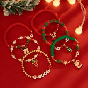 Close-up of a 5-piece Christmas bracelet set with 2025 charms and festive beads