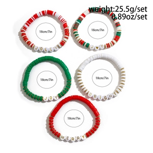 Detail of five-piece Christmas clay bead bracelets with JOLLY and MERRY lettering