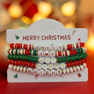 Close-up of festive Christmas beaded bracelets with Jolly, Merry and Joy letter beads