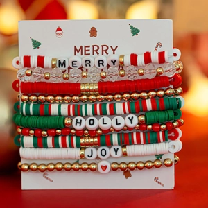 Close-up of 10-piece Christmas snowflake clay bead bracelets with Joy and Merry lettering