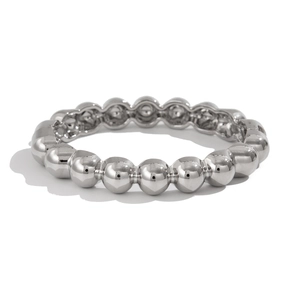 Detailed view of the polished silver beaded ring with high-gloss metallic finish