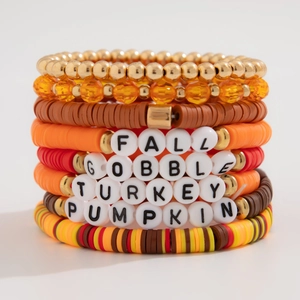 Detail of fall-themed beaded bracelets with letters GOBBLE, TURKEY and PUMPKIN