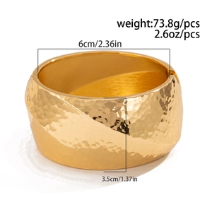 Detailed view of gold textured wide cuff bracelet showing 6cm diameter and 3.5cm width