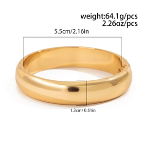 Detail of chunky gold bangle showing hinges, 5.5cm inner diameter and 64.1g weight