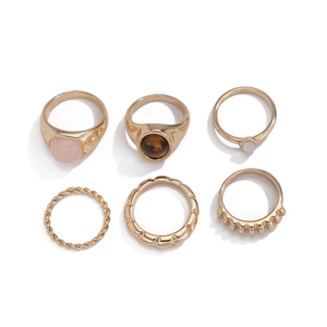 6er-Set goldene Stapelringe mit rosa Edelsteinen und vielfältigen Metalltexturen