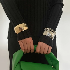 Fashionable wide hammered alloy bracelets and silver beaded bracelet set on model
