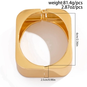 Detailed view of wide gold metal cuff bracelet with 2.5cm width and 6cm diameter