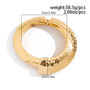Detail view of gold hammered cuff bracelet with inner diameter 6cm and width 2cm