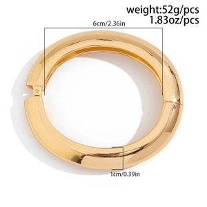 Polished gold wide metal cuff bracelet with hinge closure for women on white background