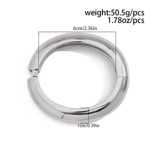 Detail view of metallic spring bangle with 6cm inner diameter and 1cm band thickness