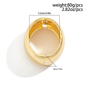 Detail view of bold chunky golden cuff bracelet with 5.2cm diameter and 4cm width specs