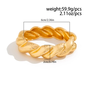 Detail shot of hammered gold-tone wide cuff bracelet with precise size measurements