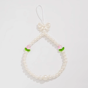 Cute beaded phone strap featuring white pearls, pink tulips, and a sweet bow charm decor