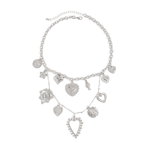 Detail view of silver molten heart pendant necklace with multi-element mixed chains