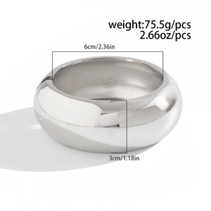 Polished silver bangle with dimensions 6cm inner diameter and 3cm wide band