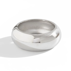 Polished silver-tone wide spring bangle bracelet with a sleek minimalist mirror finish