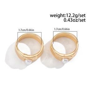 Detail view of 1.7cm liquid lava rings set with pearls and gold finish weight 12.2g