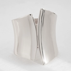 Polished silver irregular chunky cuff bracelet with an avant-garde wide open design