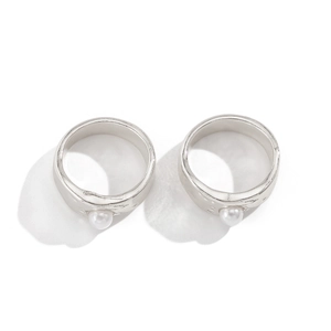 Detailed view of silver liquid lava flower ring featuring a baroque faux pearl setting