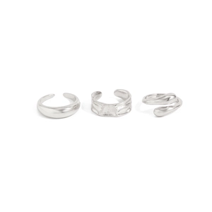 Close-up of a 3-piece silver adjustable ring set featuring smooth and pleated textures