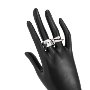 Macro shot of silver wide liquid metal ring with organic melt design on black hand model