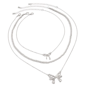 Detailed view of silver bow pendant necklaces set with adjustable lobster clasps