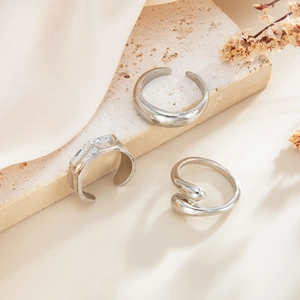 Three-piece set of minimalist silver adjustable rings with irregular geometric shapes