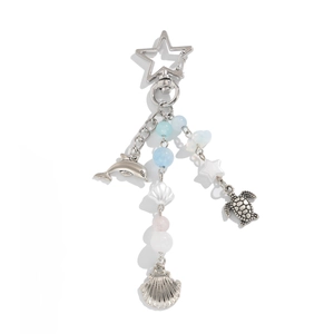 Ocean themed keychain with dolphin turtle and shell pendants on silver star clasp