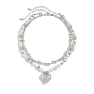 Double-layered pearl necklace with silver heart pendant and punk style barbed wire design