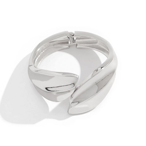 Detail view of the spring hinge mechanism and silver metallic waterdrop bangle texture