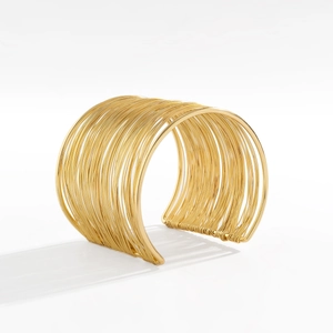 Detail view of gold wide open cuff bracelet featuring multi-layer parallel metal wires