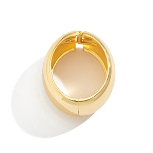 Polished chunky gold dome bracelet with a hinged closure in a minimalist metal style