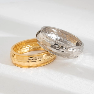 Set of two hammered texture metal open bracelets in gold and silver finish