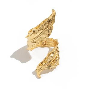 Golden liquid metal leaf wrap bangle with textured vein details and spring closure