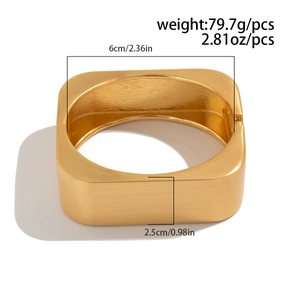 Detail showing 2.5cm wide gold cuff bangle with brushed texture finish and measurements