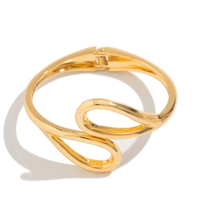 Minimalist irregular hollow gold bangle with a streamlined cross-twist design and hinge closure