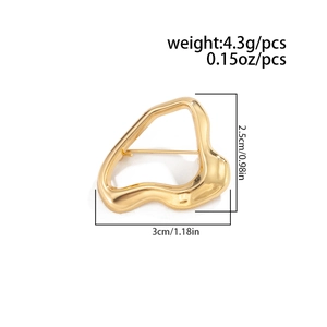 Detailed view of gold irregular textured brooch with dimensions 3cm by 2.5cm