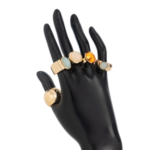 Detailed view of 5-piece gold-plated ring set with colorful acrylic stones and textured bands