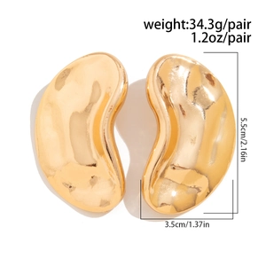 Detail view of large gold-tone curved earrings with specific size and weight measurements