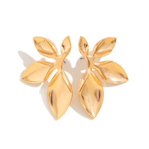 Detailed close-up of golden leaf-shaped stud earrings in polished metallic alloy