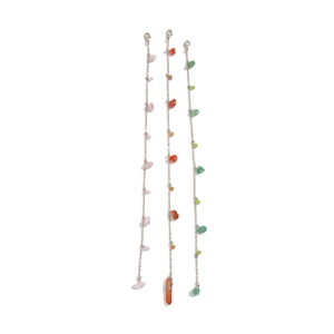 Detailed view of layered bohemian necklaces with turquoise, crystal, and shell charms