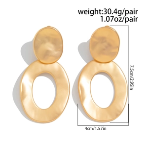 Detail view of gold geometric drop earrings showing weight 30.4g and 7.5cm size