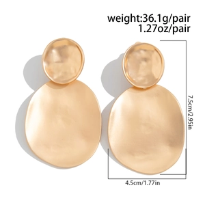 Detailed view of matte gold geometric earrings with hammered texture and size measurements